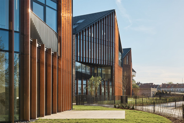 The Missionary Gardens - Copper facades create human scaled glass facade  rhythm, © ©Norbert Tukaj, Photographer: ©Norbert Tukaj